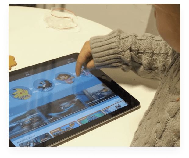 A child tapping through the Viaplay kids interface on an iPad